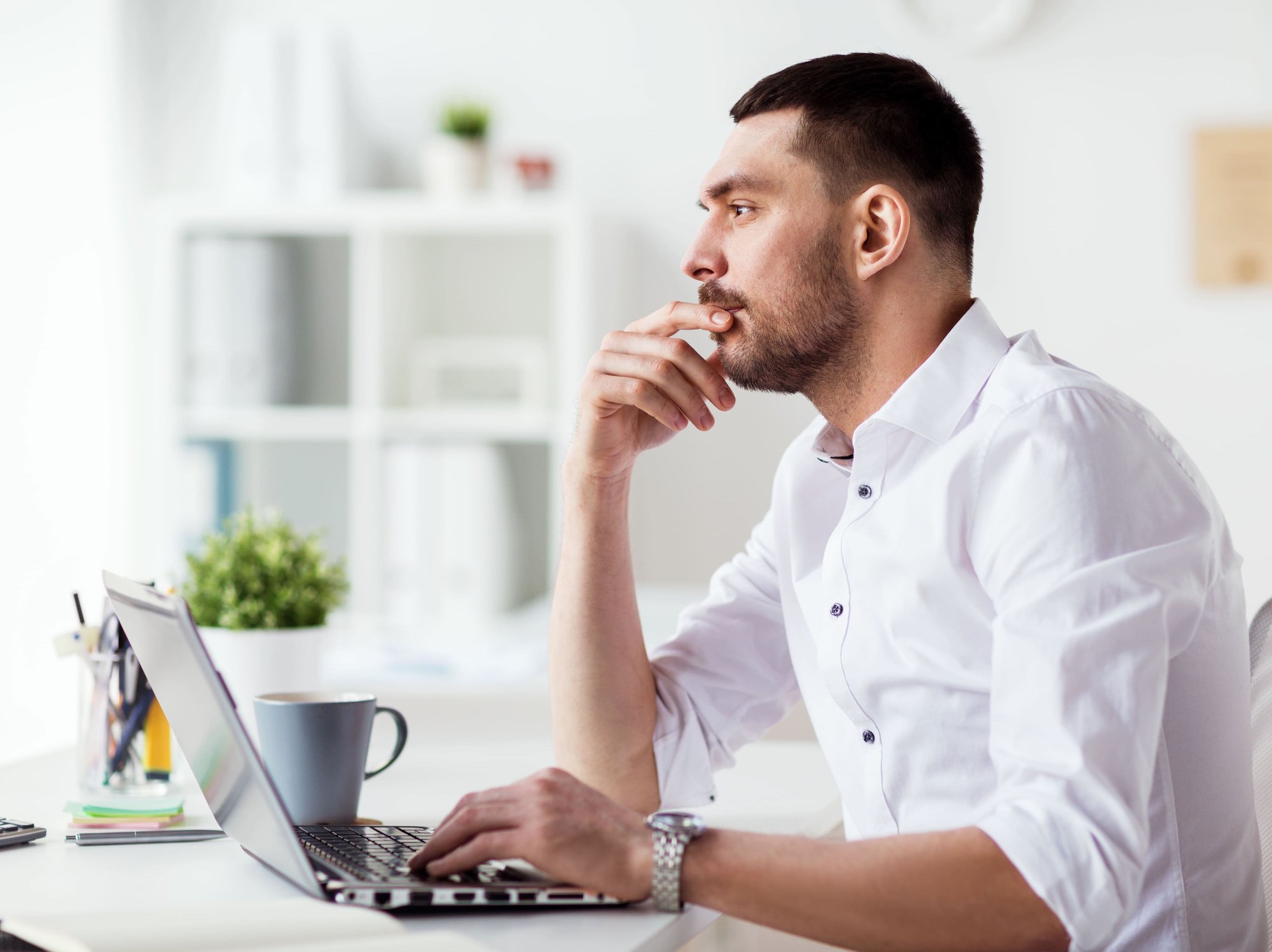 businessman-with-laptop-thinking-at-office-2021-08-26-22-49-15-utc (1)-1